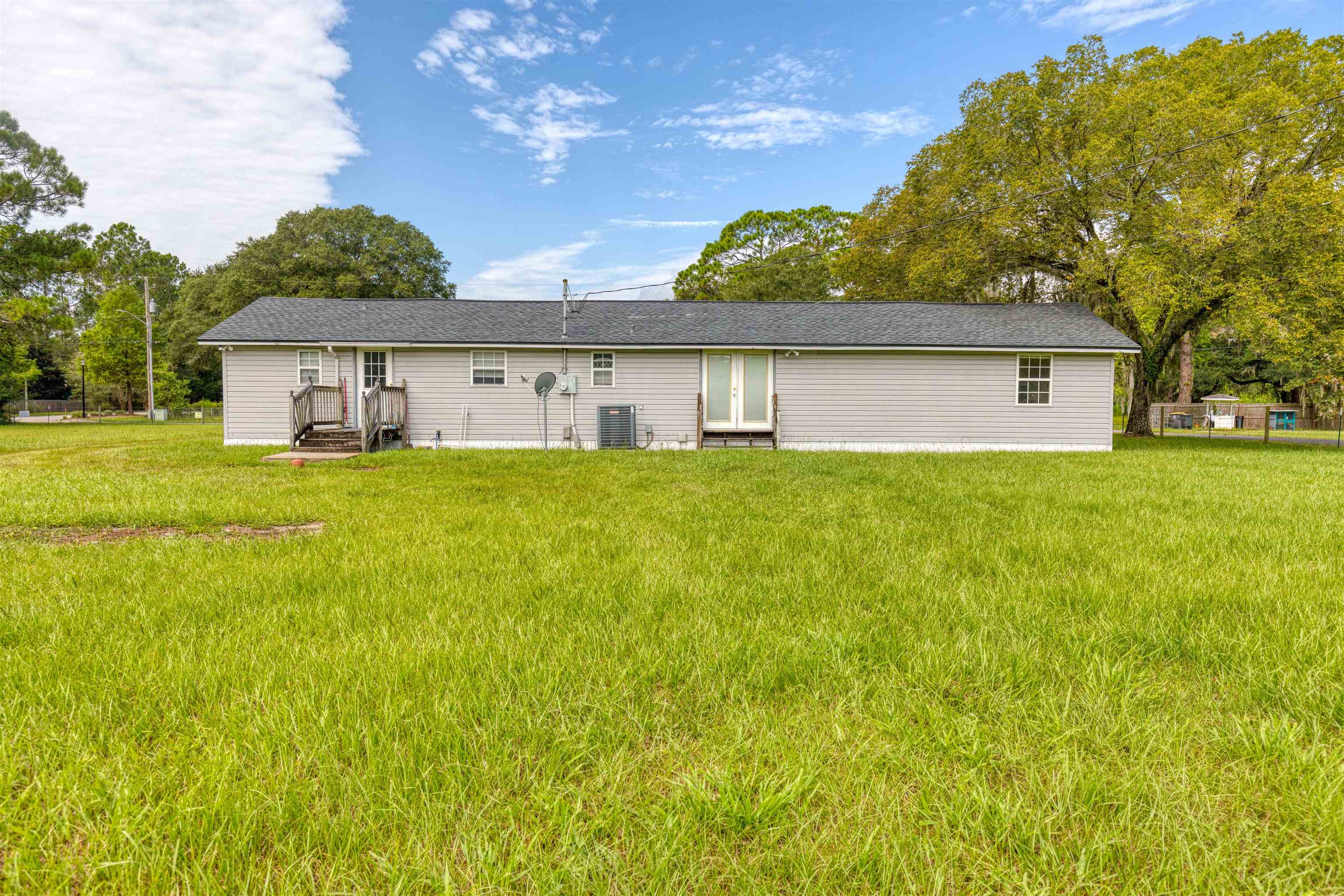5715 Monroe Smith Road Jacksonville, FL 32210 - Photo 19 of 23 a house view with a garden space