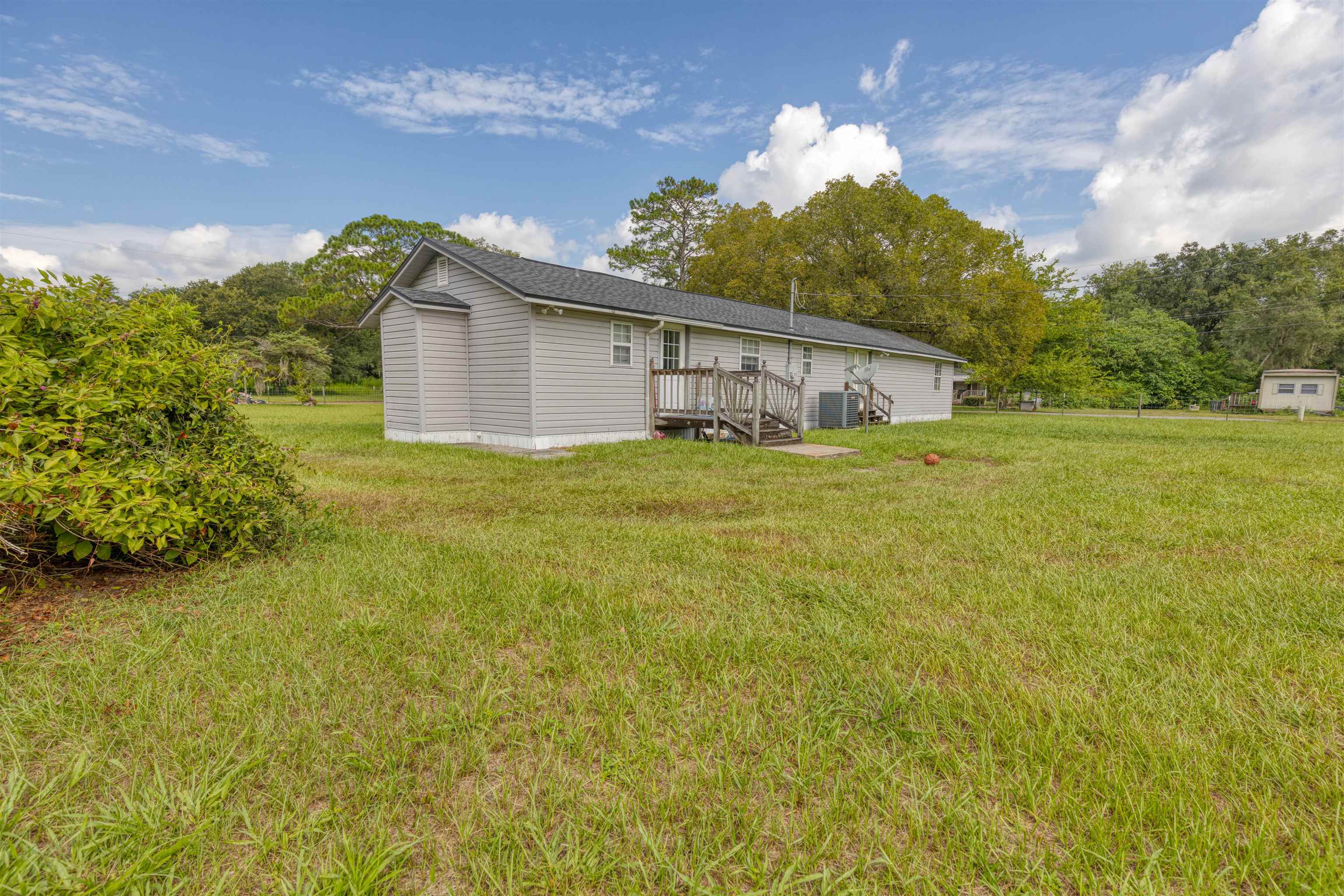 5715 Monroe Smith Road Jacksonville, FL 32210 - Photo 21 of 23 a house view with a garden space