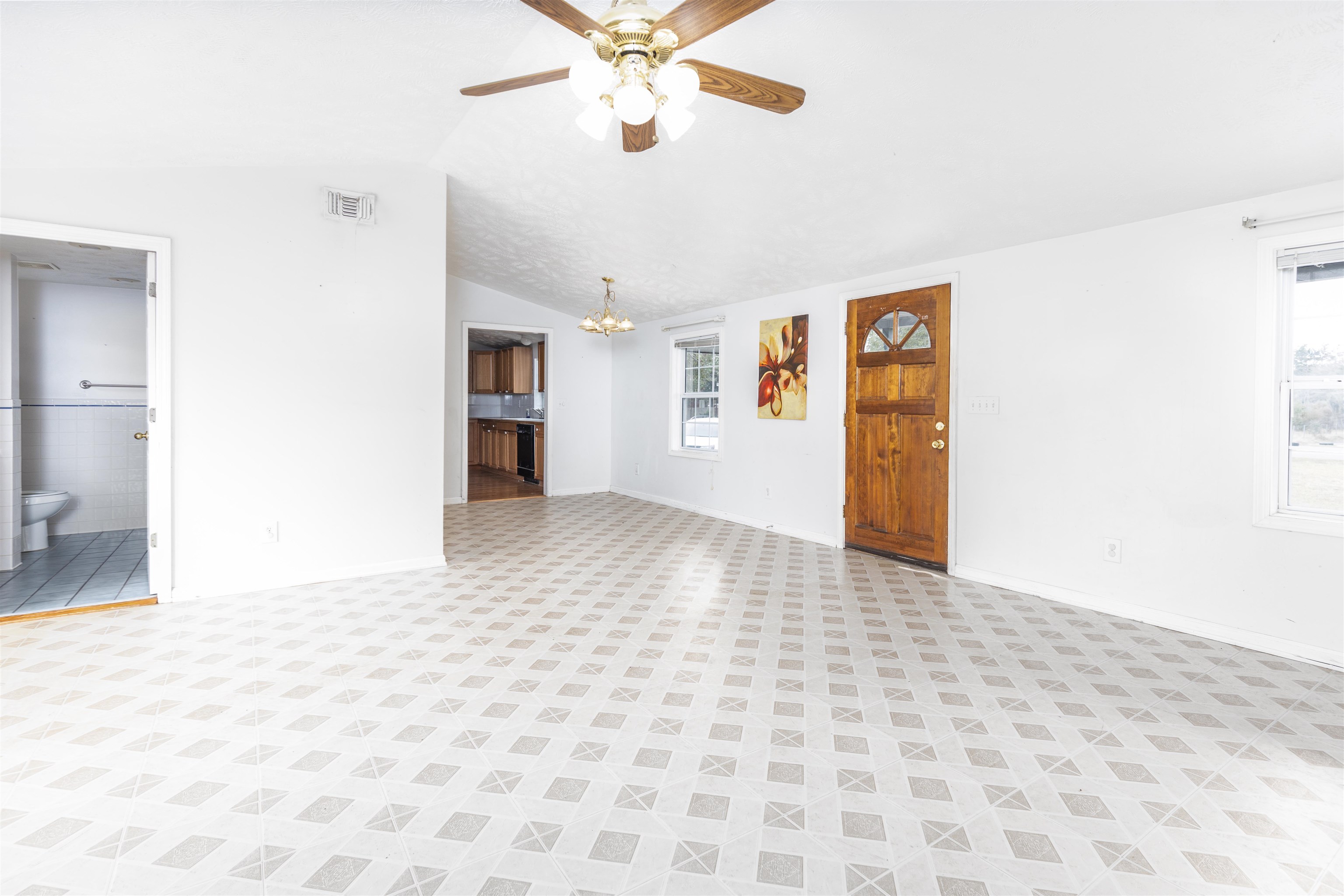 5715 Monroe Smith Road Jacksonville, FL 32210 - Photo 23 of 23 a view of an empty room with window and a kitchen
