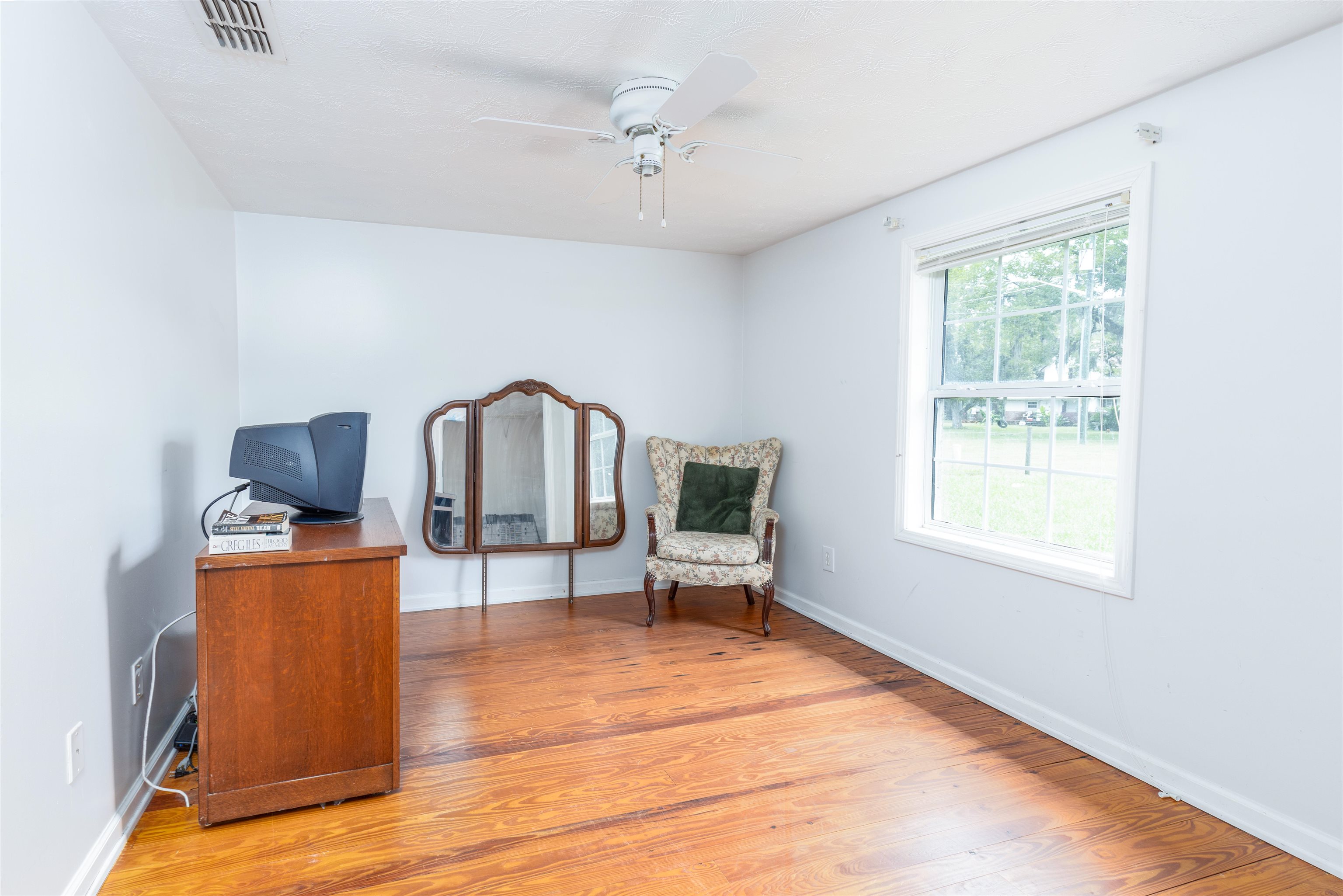 5715 Monroe Smith Road Jacksonville, FL 32210 - Photo 8 of 23 a living room with furniture and a window