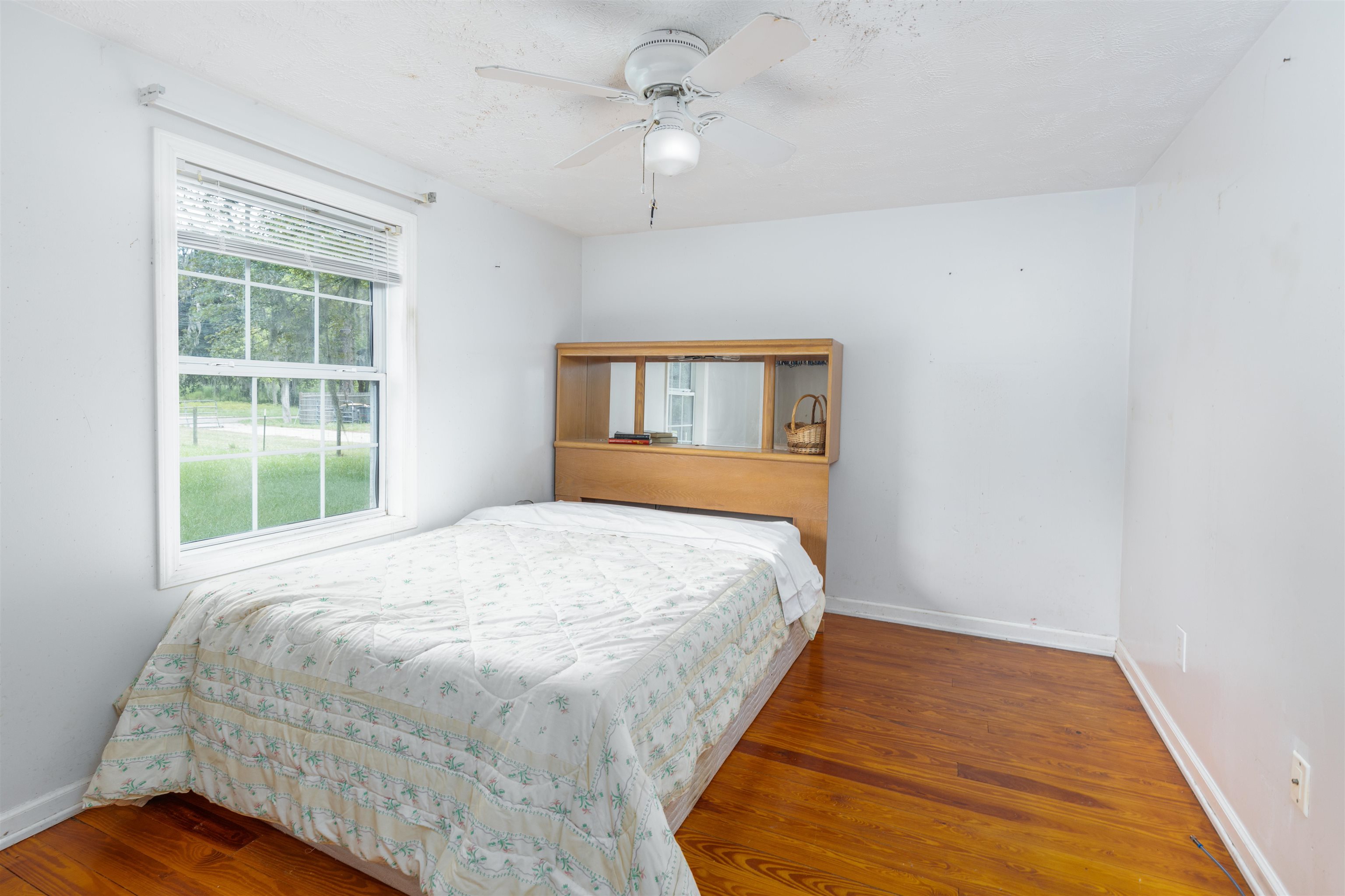 5715 Monroe Smith Road Jacksonville, FL 32210 - Photo 10 of 23 a bedroom with a bed and a window