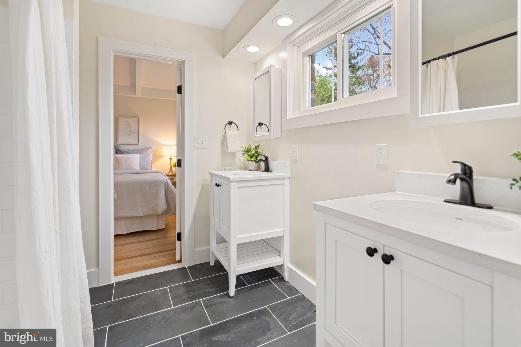 556 Valley View Road Towson, MD 21286 - Photo 25 of 43 a bathroom with a sink and a mirror