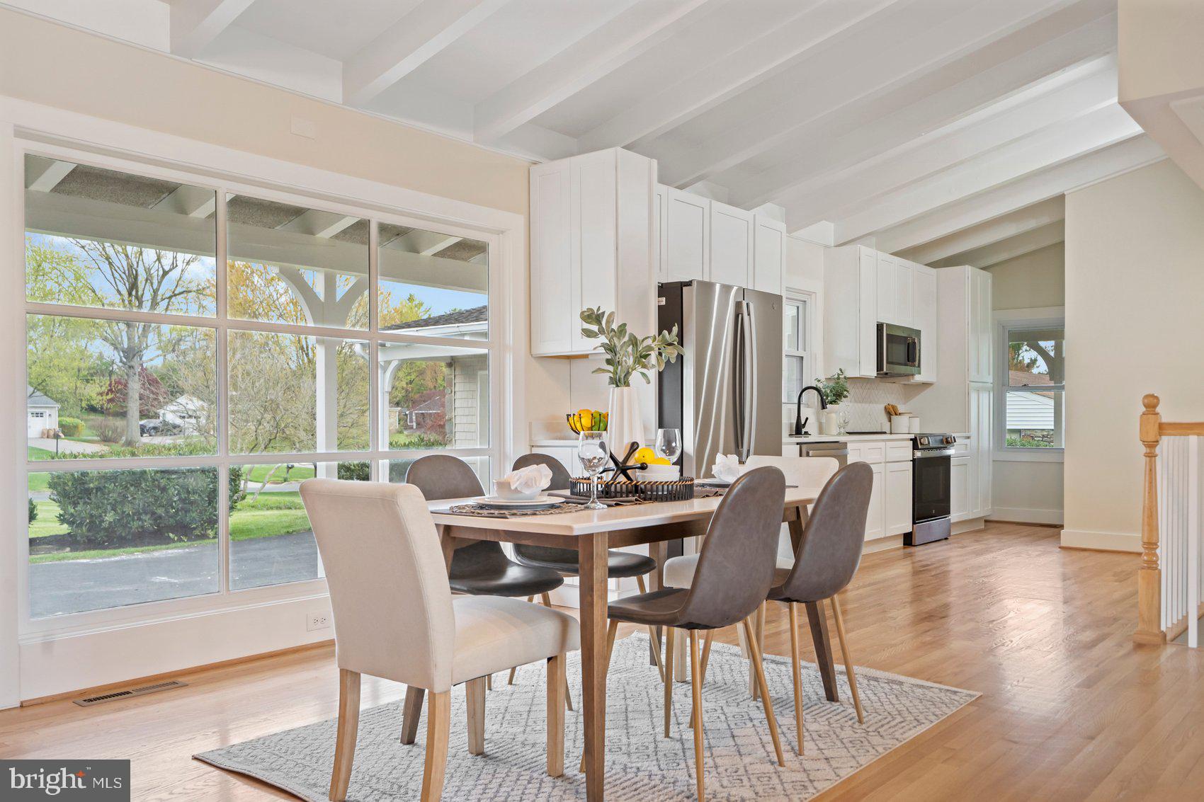 556 Valley View Road Towson, MD 21286 - Photo 6 of 43 a view of a dining room with furniture and wooden floor