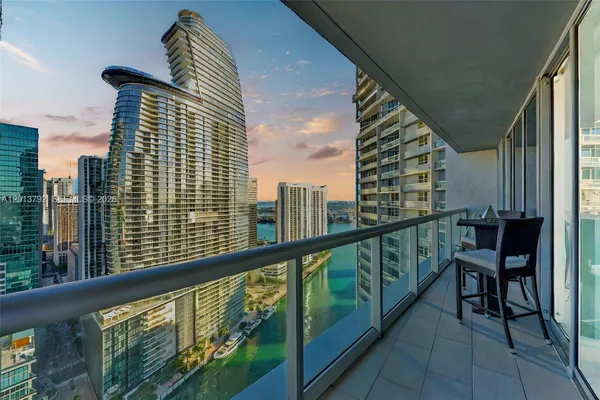 a view of a balcony with chairs