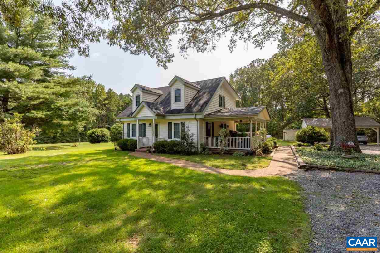 1830 Hunters Lodge Road Palmyra, VA 22963 - Photo 1 of 32 a front view of house with yard and green space