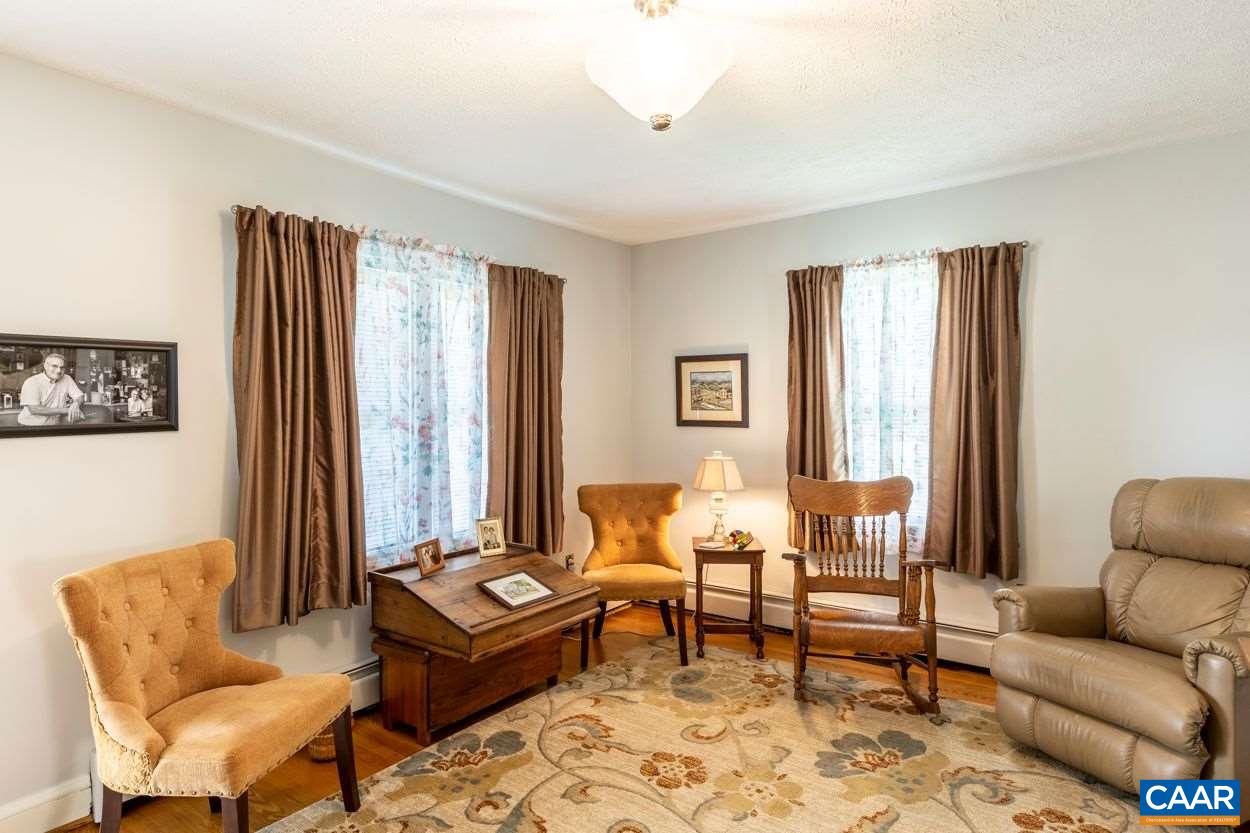 1830 Hunters Lodge Road Palmyra, VA 22963 - Photo 17 of 32 a living room with furniture and a large window