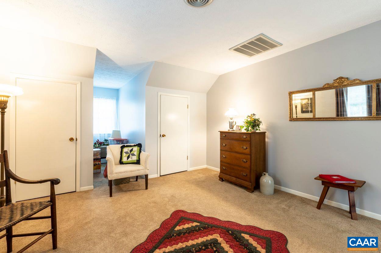 1830 Hunters Lodge Road Palmyra, VA 22963 - Photo 18 of 32 a bedroom with furniture and a window