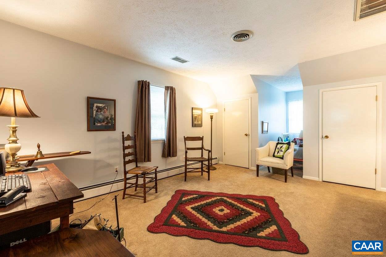 1830 Hunters Lodge Road Palmyra, VA 22963 - Photo 20 of 32 a living room with furniture and a wooden floor