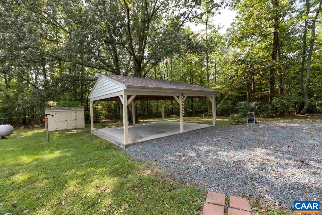 1830 Hunters Lodge Road Palmyra, VA 22963 - Photo 26 of 32 a view of a house with backyard and porch