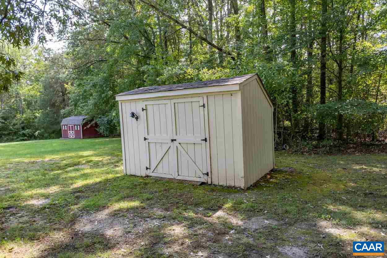 1830 Hunters Lodge Road Palmyra, VA 22963 - Photo 28 of 32 a view of a backyard with barn