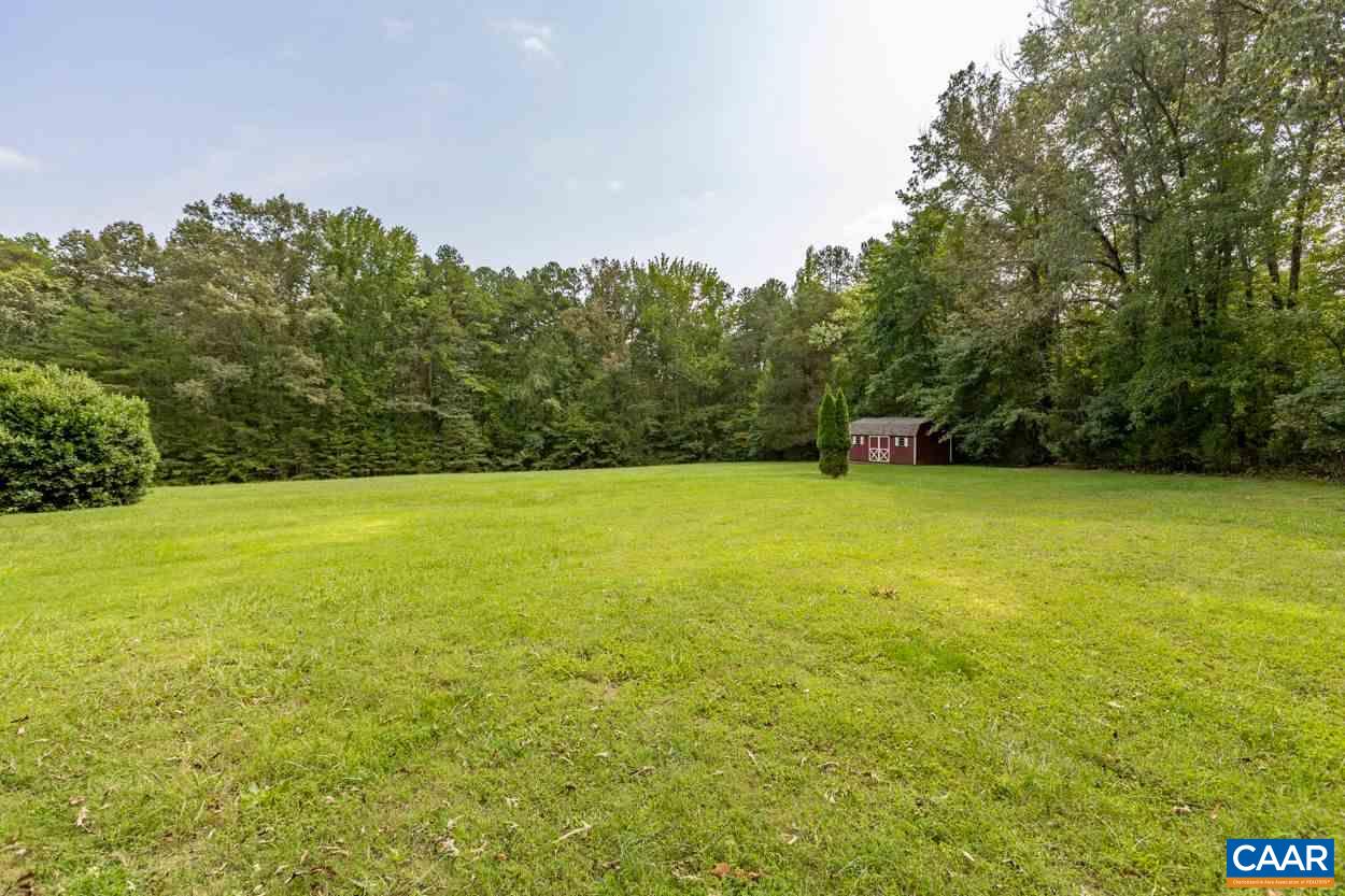1830 Hunters Lodge Road Palmyra, VA 22963 - Photo 30 of 32 a view of yard with swimming pool and green space