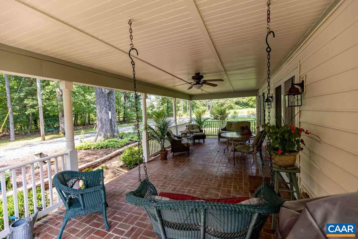 1830 Hunters Lodge Road Palmyra, VA 22963 - Photo 6 of 32 a view of a dining room with furniture window and outside view