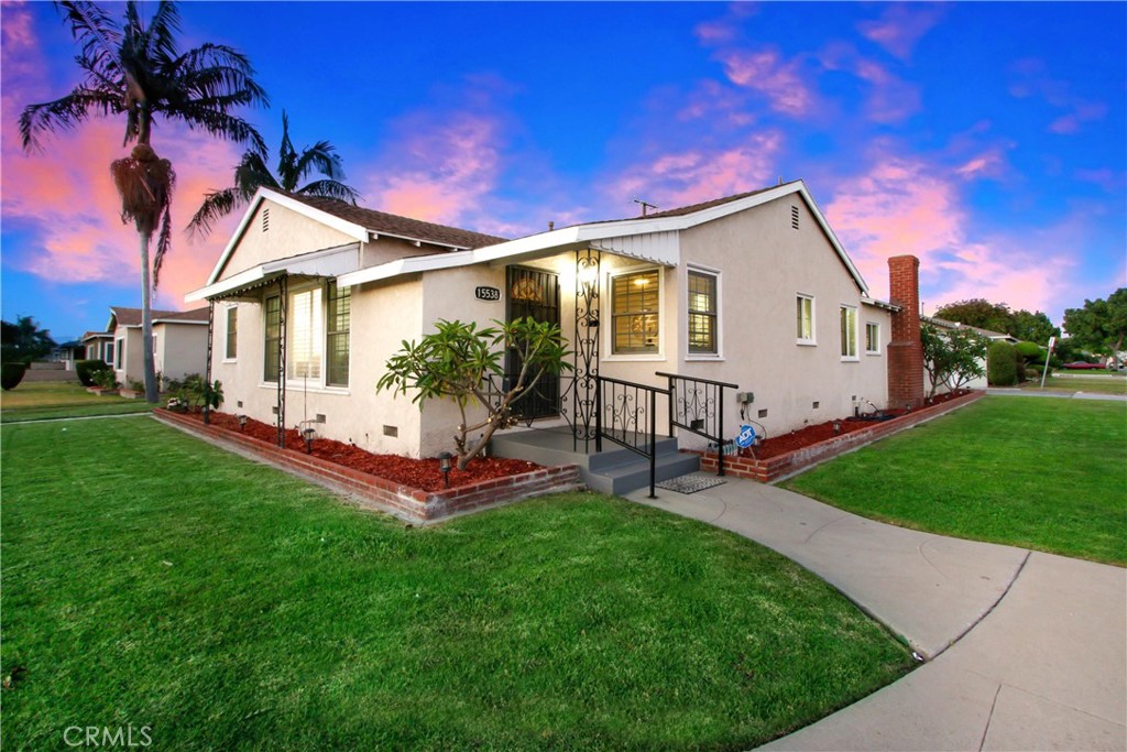 a view of a house with a yard porch and sitting area