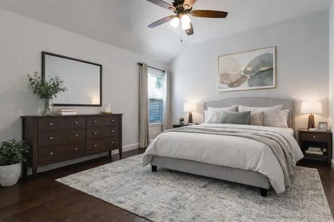 a bedroom with a bed and window