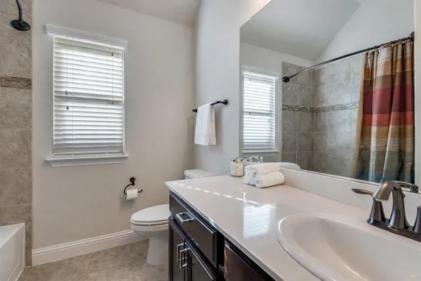 a bathroom with 2 sink and a mirror