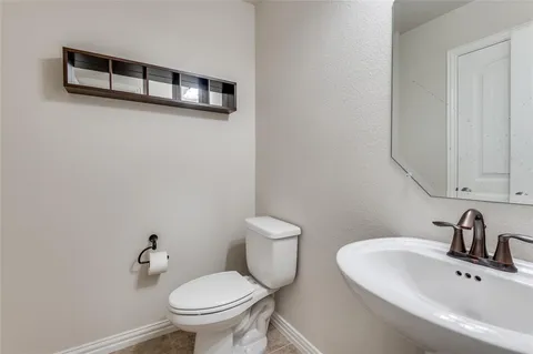 a bathroom with a sink and a toilet