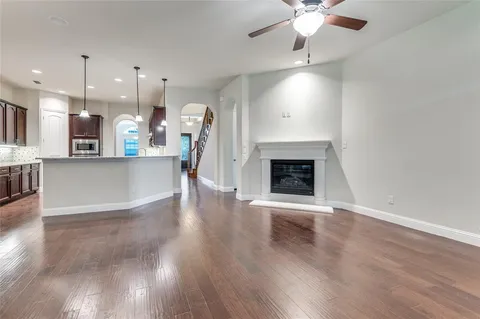 a view of a kitchen with a stove cabinets and wooden floor