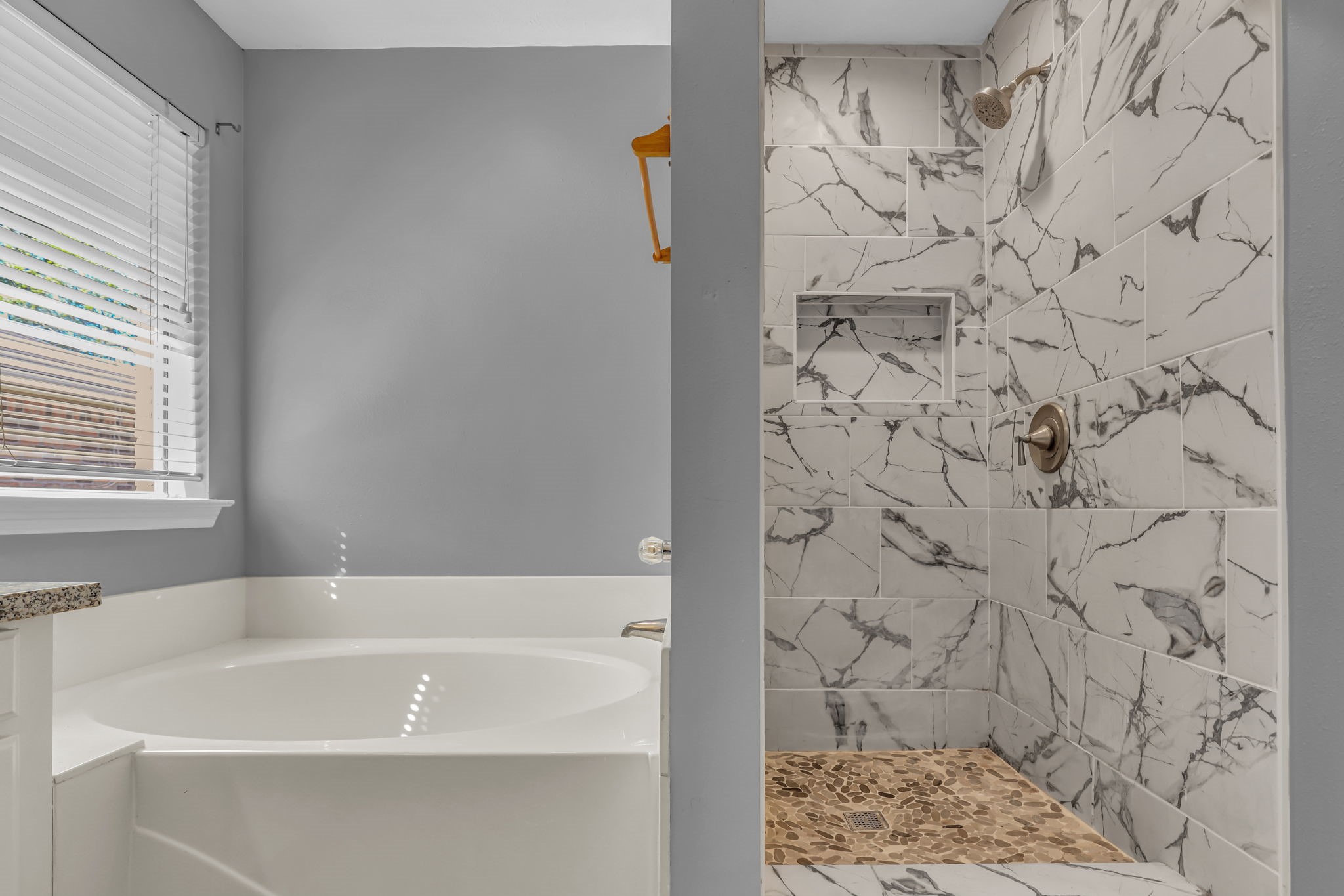 15503 West Little York Road Houston, TX 77084 - Photo 13 of 22 a bathroom with a bathtub and shower