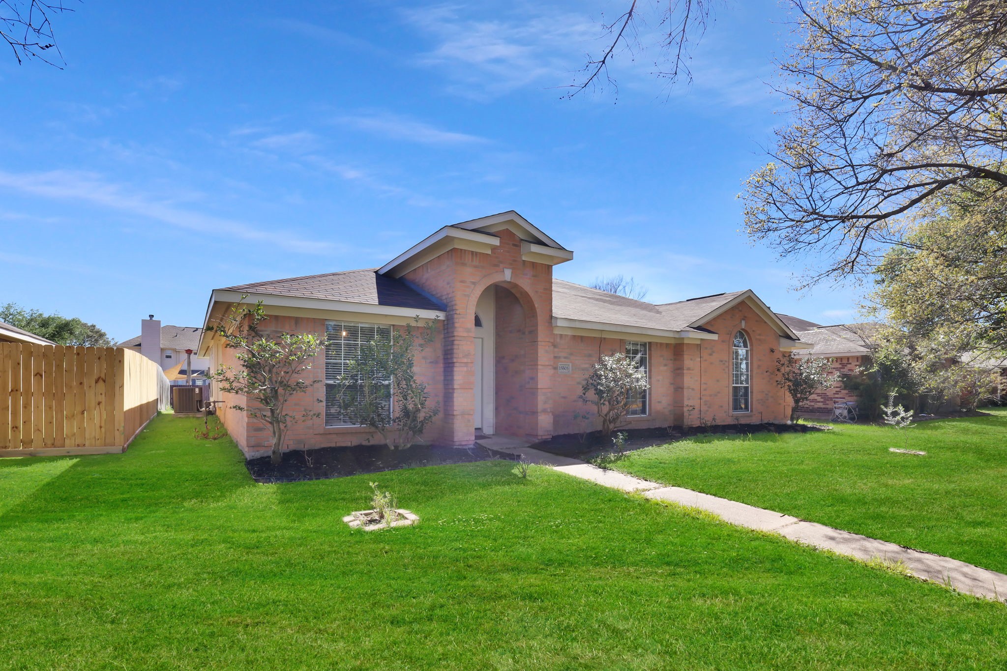 15503 West Little York Road Houston, TX 77084 - Photo 3 of 22 a front view of a house with garden