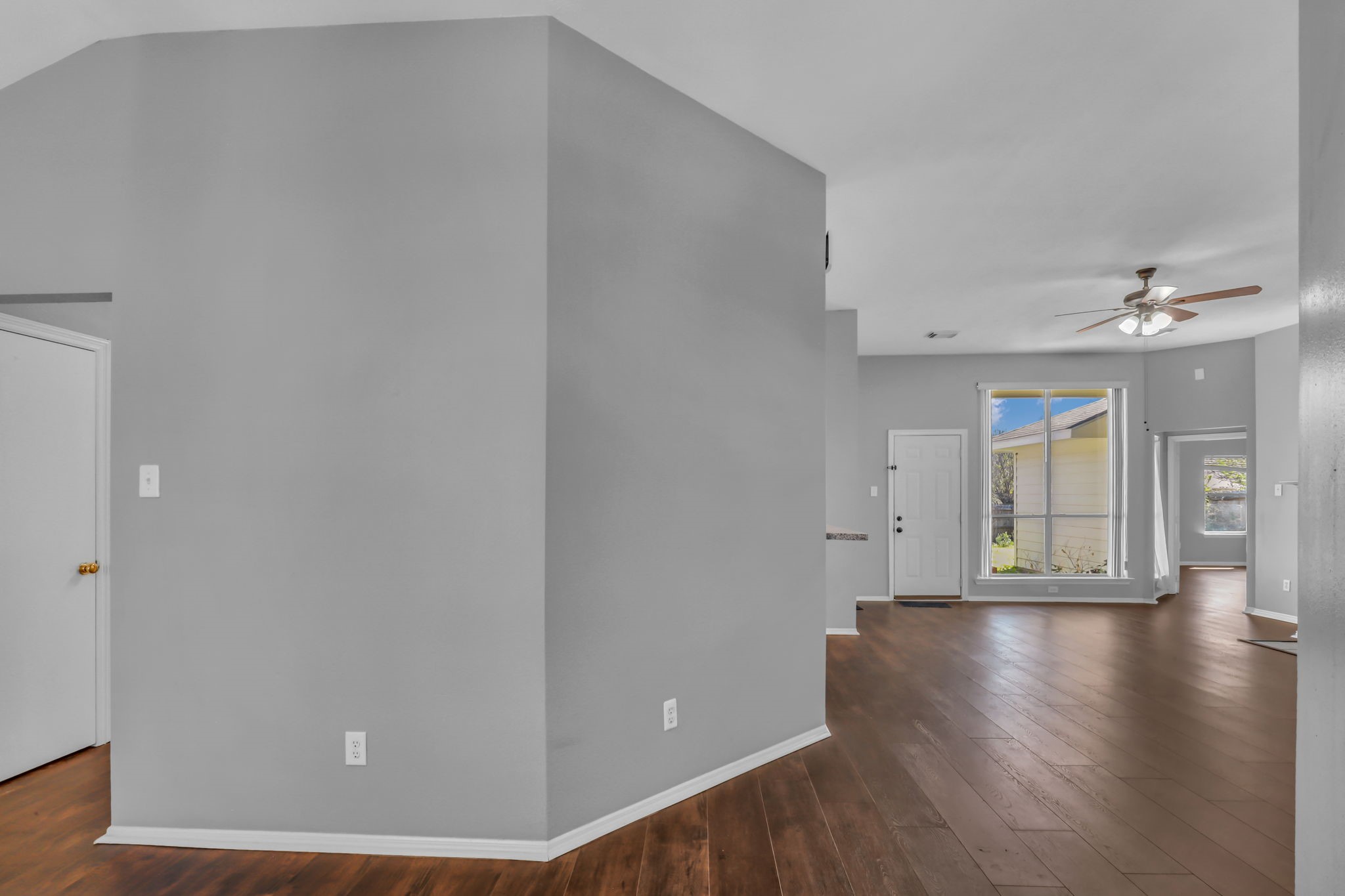 15503 West Little York Road Houston, TX 77084 - Photo 4 of 22 a view of an empty room with wooden floor and a window