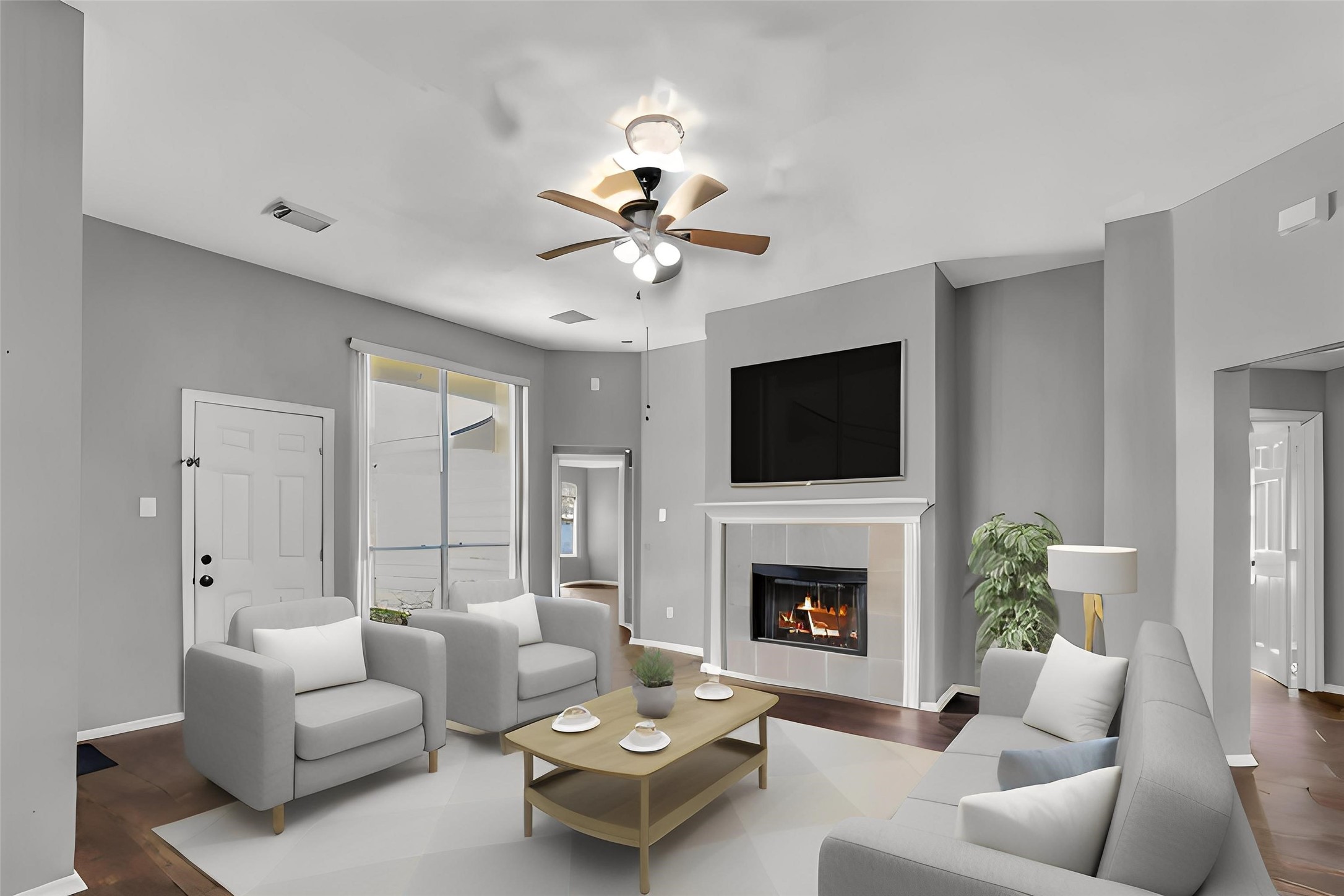 15503 West Little York Road Houston, TX 77084 - Photo 9 of 22 a living room with furniture fireplace and a flat screen tv