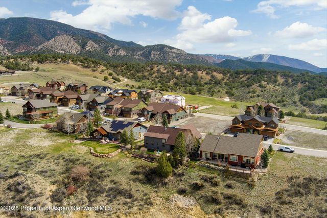 a view of a city with mountains in the background