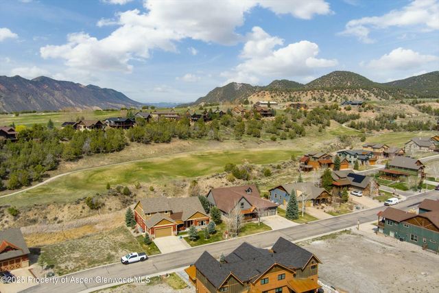 a view of a city with mountains in the background