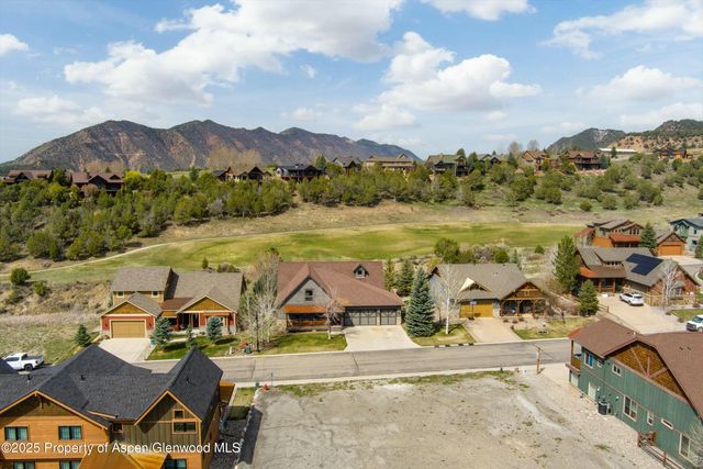 an aerial view of a house with outdoor space