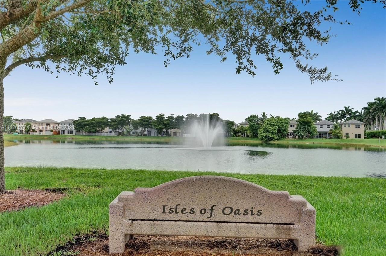 134 Northeast 28th Terrace, Unit 4 Homestead, FL 33033 - Photo 2 of 33 a view of lake with green space