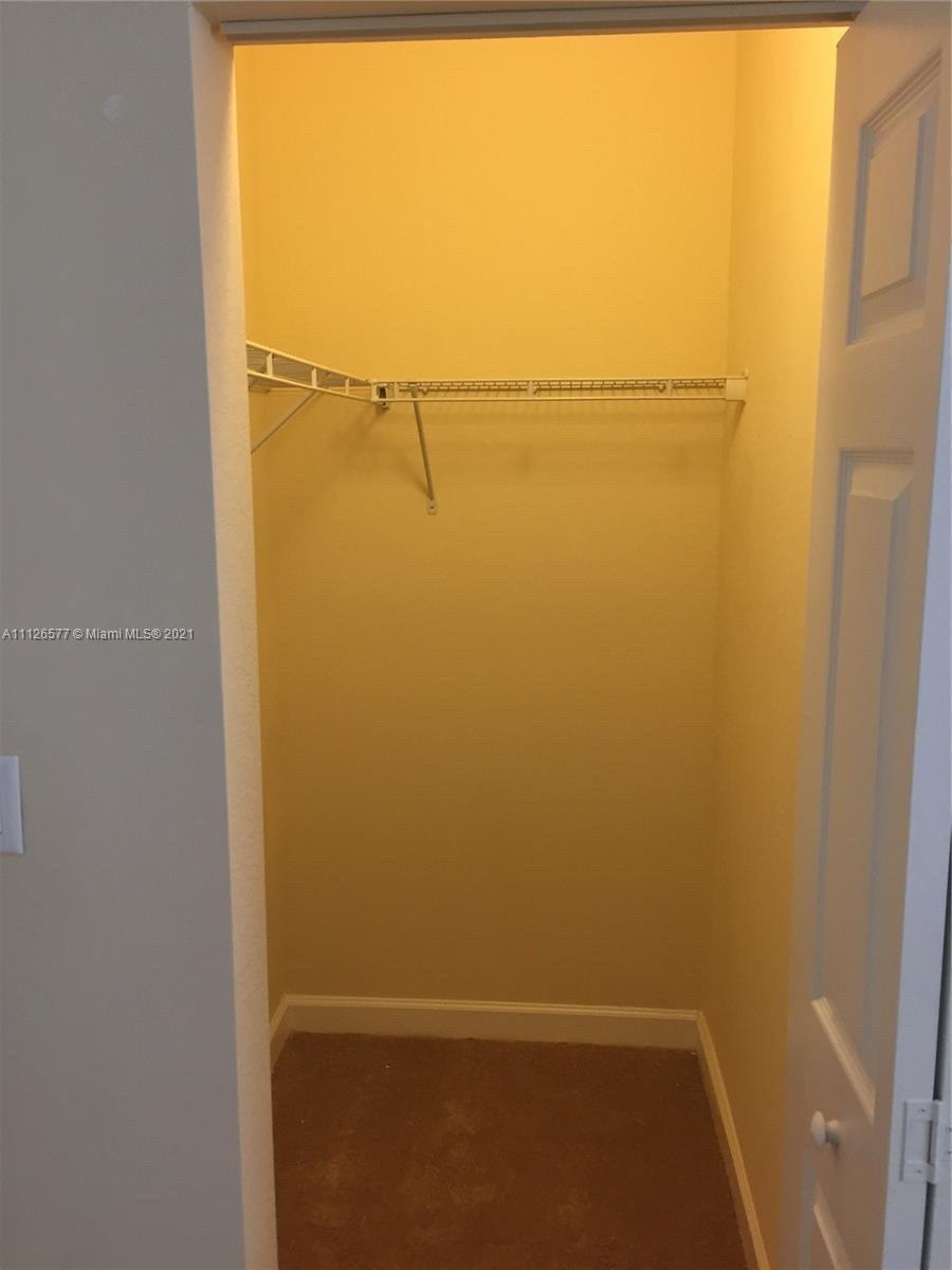 134 Northeast 28th Terrace, Unit 4 Homestead, FL 33033 - Photo 11 of 33 a view of walk in closet