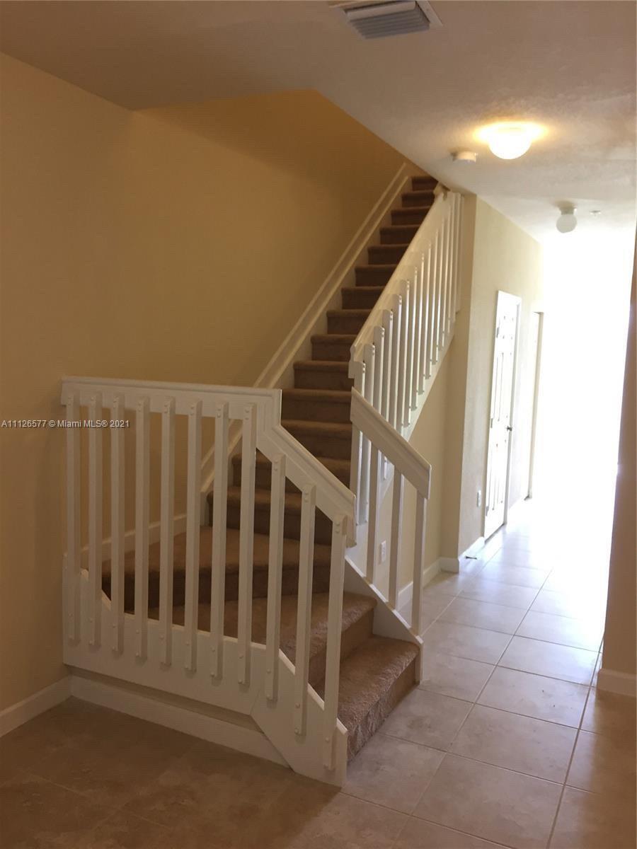 134 Northeast 28th Terrace, Unit 4 Homestead, FL 33033 - Photo 18 of 33 a view of entryway with wooden floor