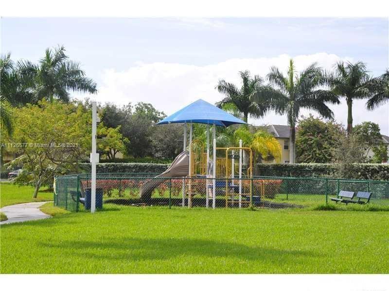 134 Northeast 28th Terrace, Unit 4 Homestead, FL 33033 - Photo 22 of 33 a view of a house with a big yard