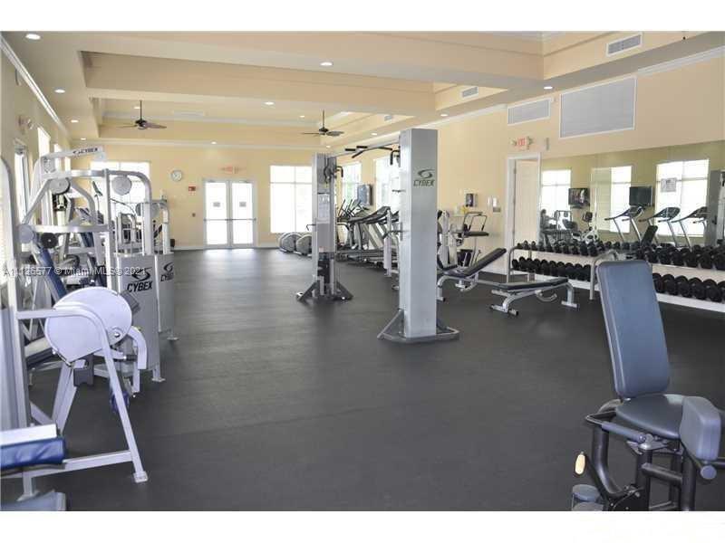 134 Northeast 28th Terrace, Unit 4 Homestead, FL 33033 - Photo 23 of 33 a view of a room with gym equipment