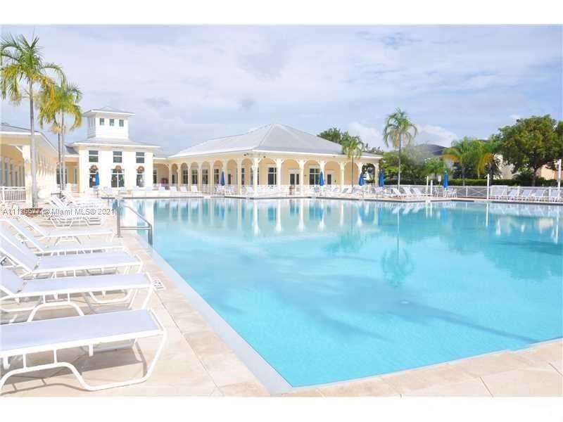134 Northeast 28th Terrace, Unit 4 Homestead, FL 33033 - Photo 27 of 33 a view of swimming pool with outdoor seating and plants