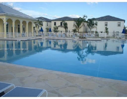 134 Northeast 28th Terrace, Unit 4 Homestead, FL 33033 - Photo 29 of 33 a view of a house with lake view