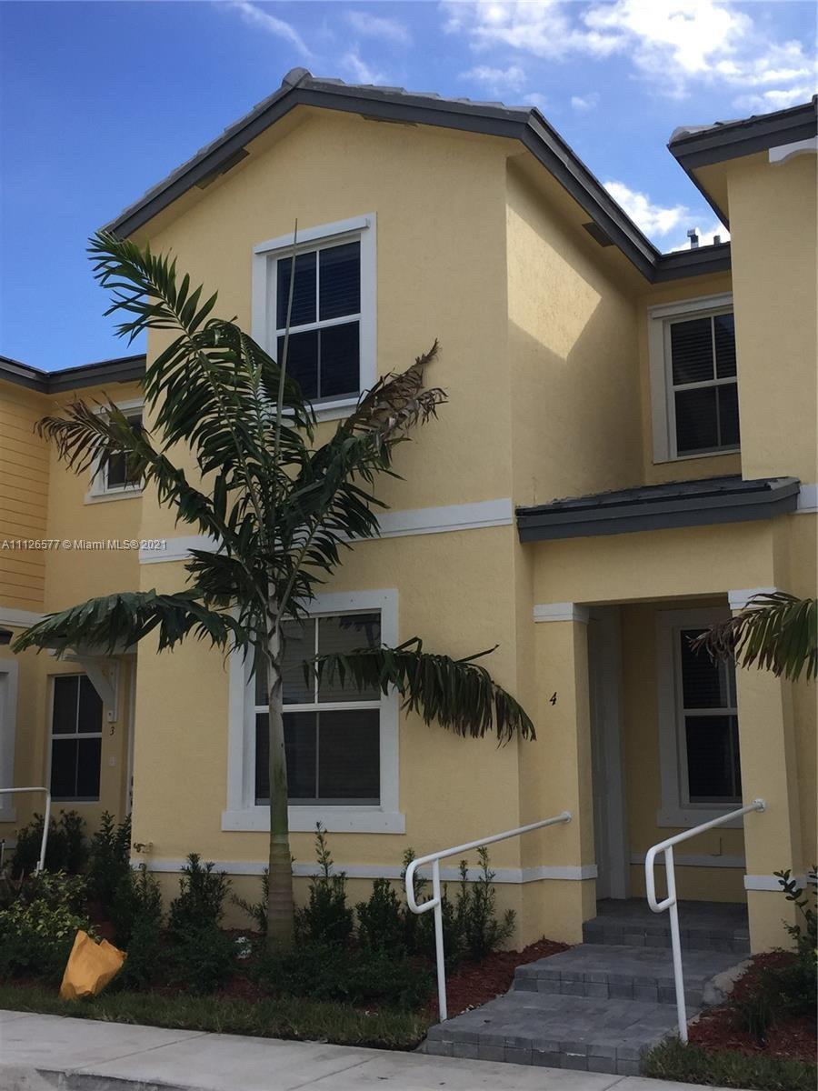 134 Northeast 28th Terrace, Unit 4 Homestead, FL 33033 - Photo 4 of 33 a house view with a outdoor space