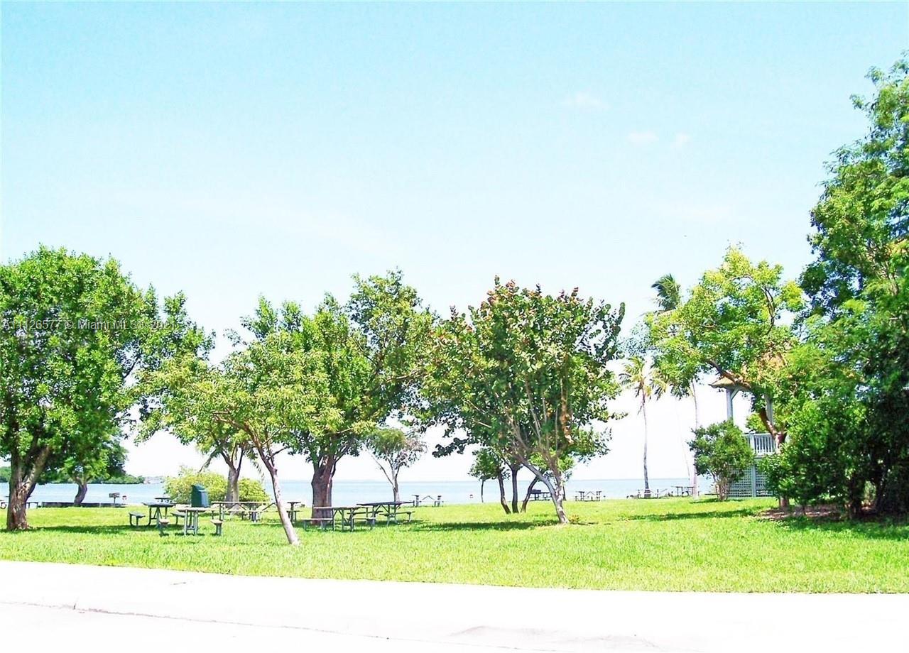 134 Northeast 28th Terrace, Unit 4 Homestead, FL 33033 - Photo 33 of 33 a view of a golf course with a trees