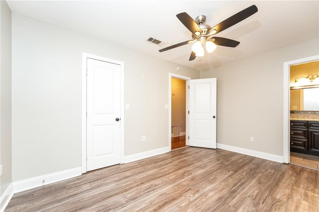 528 Newlin Court Lawrenceville, GA 30046 - Photo 15 of 30 a view of an empty room with window and wooden floor