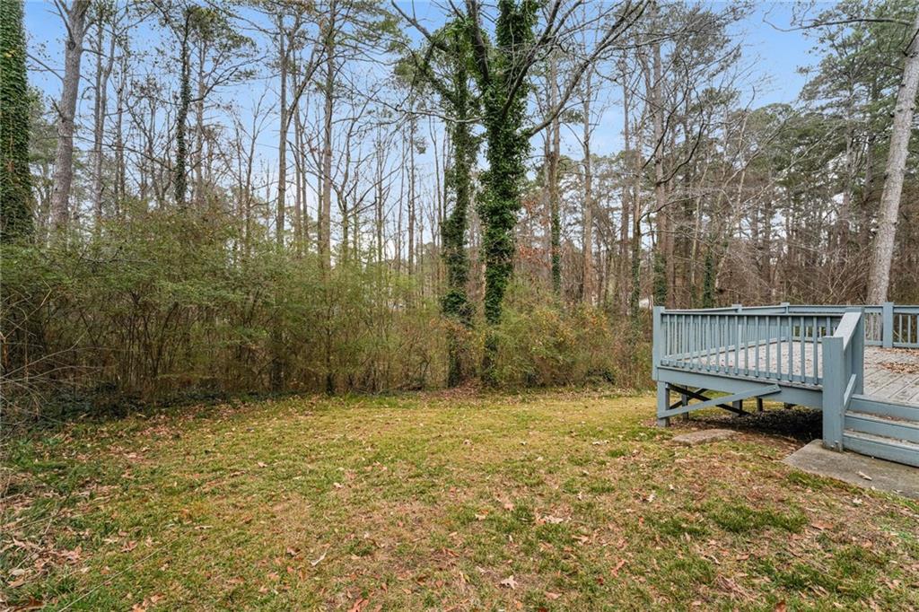 528 Newlin Court Lawrenceville, GA 30046 - Photo 27 of 30 a backyard of a house with lots of green space