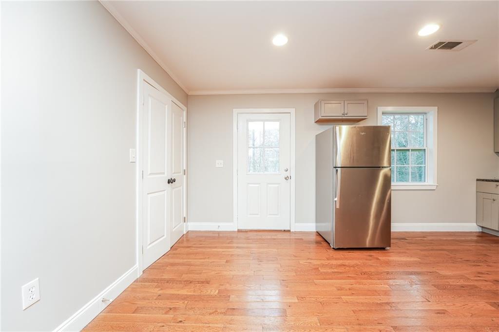 528 Newlin Court Lawrenceville, GA 30046 - Photo 10 of 30 a view of a refrigerator in kitchen and a window