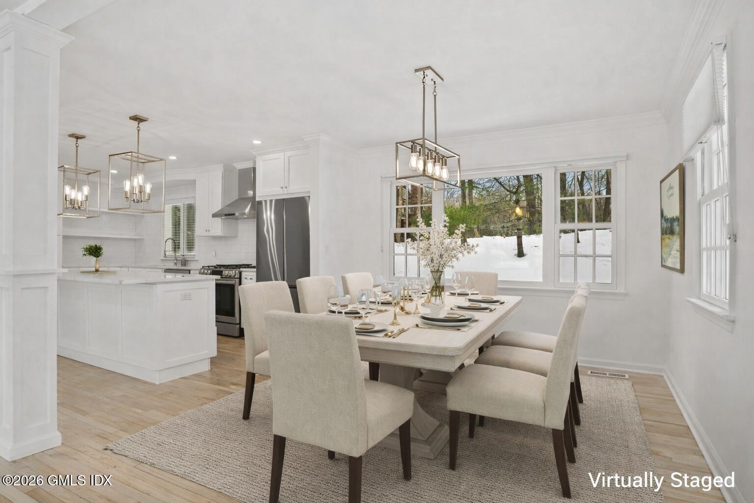 104 Hillcrest Park Road Cos Cob, CT 06807 - Photo 12 of 25 a view of a dining room that has a table and chairs