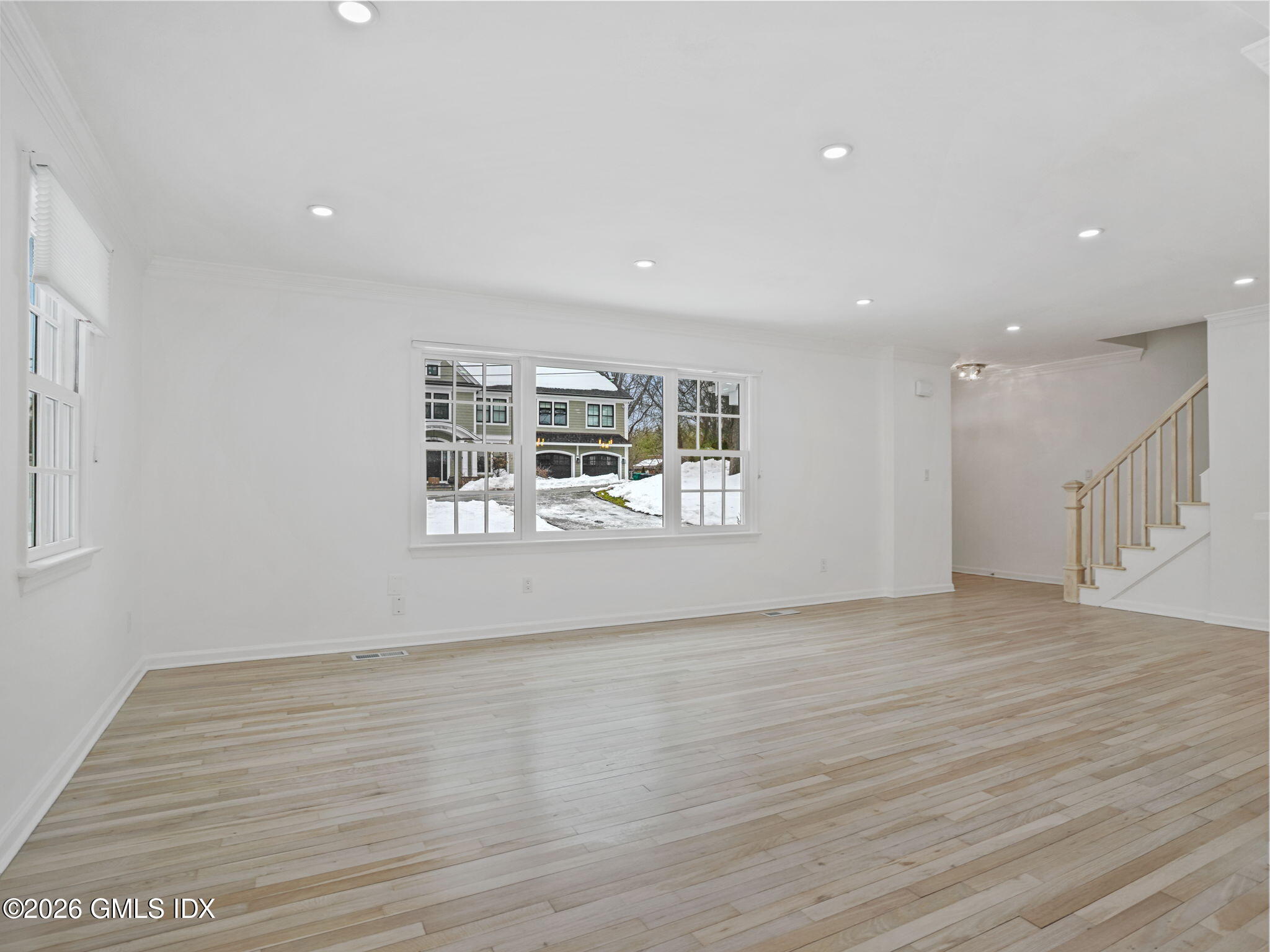 104 Hillcrest Park Road Cos Cob, CT 06807 - Photo 5 of 25 a view of an empty room with wooden floor and a window