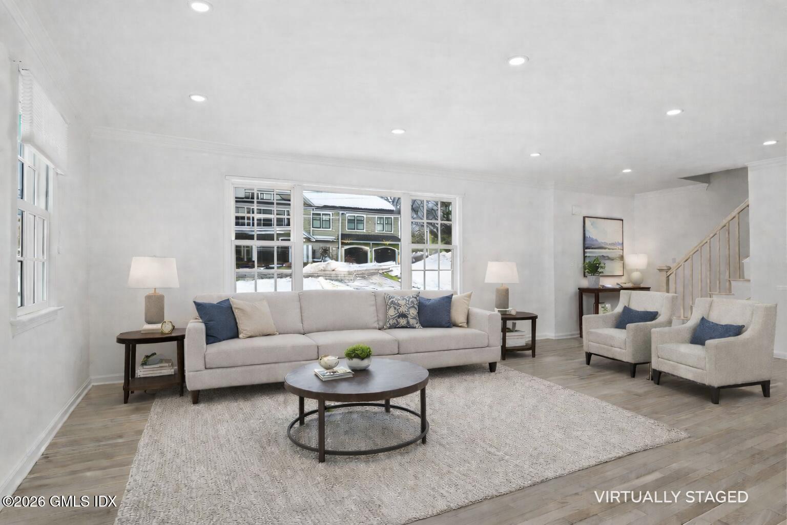 104 Hillcrest Park Road Cos Cob, CT 06807 - Photo 6 of 25 a living room with furniture and a large window
