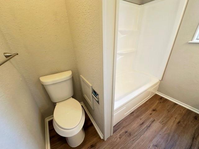 1045 HCR 2124 Loop Whitney, TX 76692 - Photo 17 of 26 a white toilet sitting next to a shower