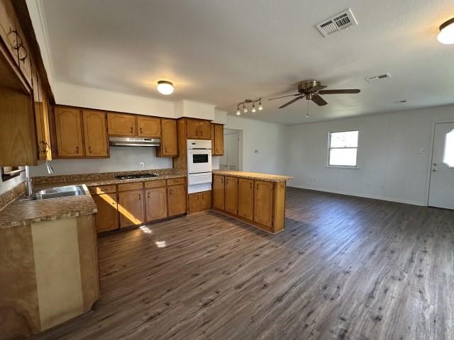 1045 HCR 2124 Loop Whitney, TX 76692 - Photo 22 of 26 a kitchen with stainless steel appliances a refrigerator and a stove top oven