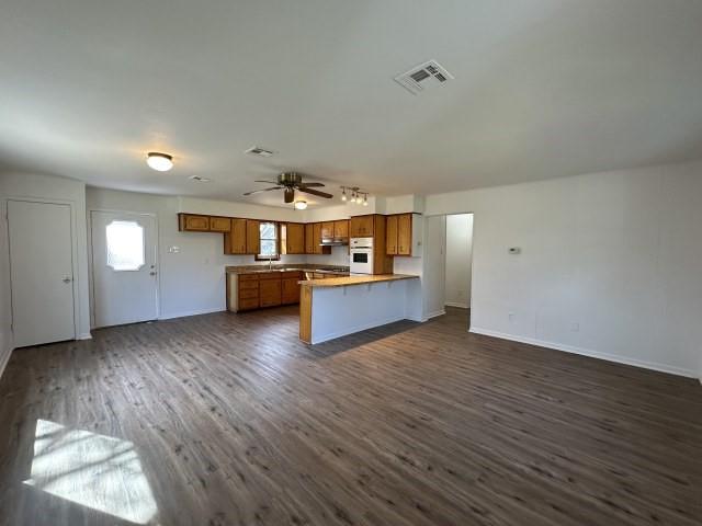 1045 HCR 2124 Loop Whitney, TX 76692 - Photo 23 of 26 an empty room with wooden floor and windows