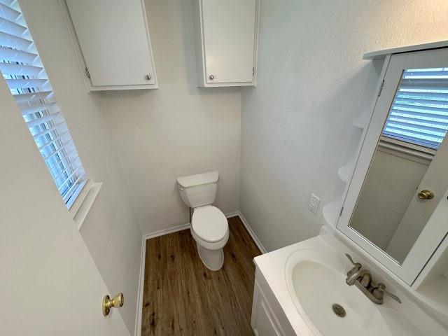 1045 HCR 2124 Loop Whitney, TX 76692 - Photo 25 of 26 a bathroom with a toilet sink and mirror