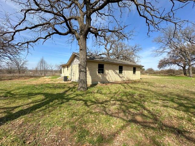 1045 HCR 2124 Loop Whitney, TX 76692 - Photo 3 of 26 a view of a house with a yard