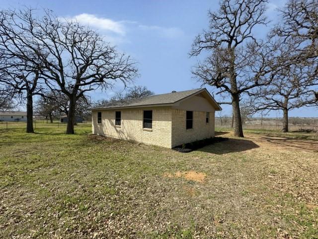 1045 HCR 2124 Loop Whitney, TX 76692 - Photo 4 of 26 a view of a house with a yard