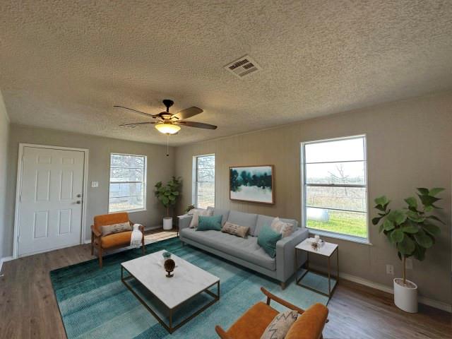 1045 HCR 2124 Loop Whitney, TX 76692 - Photo 7 of 26 a living room with furniture and a window